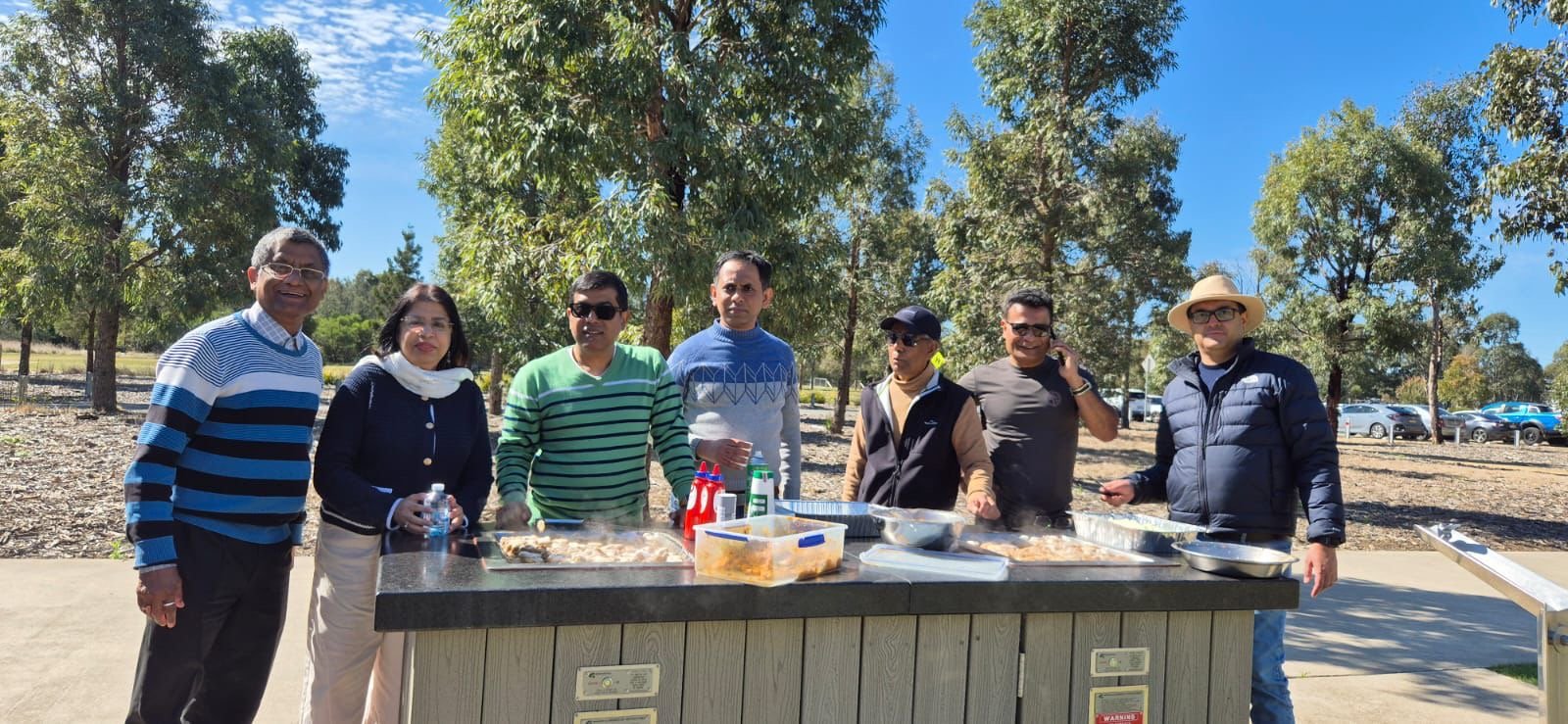 About Us Alumni at a barbecue in a Sydney park
